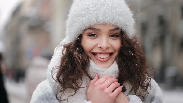 A Woman is Standing in the Center of the City and Freezing