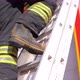 A firefighter climbs the ladder,stairs.. Fire house background. Fireman background.	 - VideoHive Item for Sale