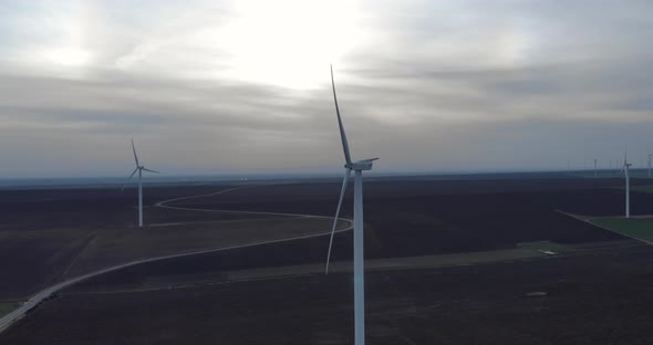 Aerial View on Wind Turbine Renewable Energy Production Farm at Dawn