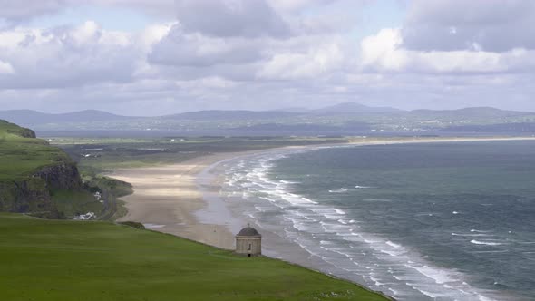 Downhill beach and Mussenden Temple on the Causeway Coastal Route, Northern Ireland.