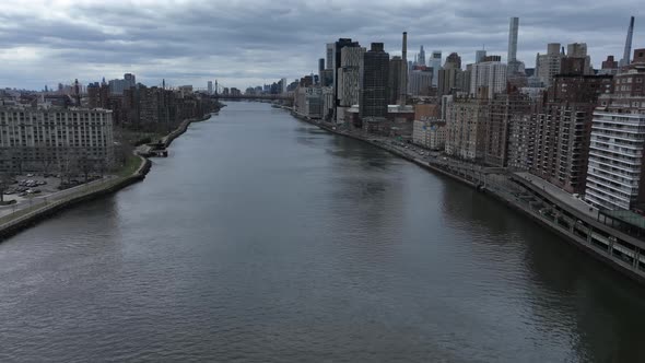 An aerial time-lapse over the east river with Roosevelt Island and Manhattan's Eastside in view on a