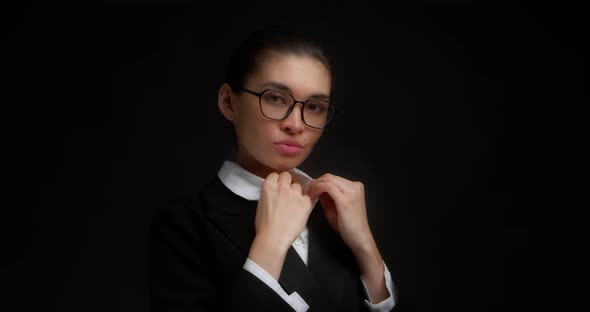 Beautiful Confident Business Woman Adjusts the Lapel on Her Jacket