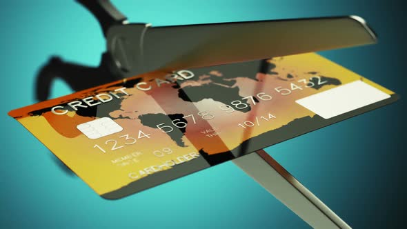 Slow motion animation of a credit card being cut by a pair of scissors. HD