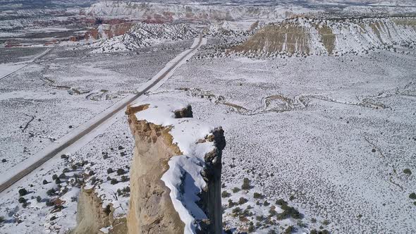 Aerial view of skinny ledge on mesa cover in snow