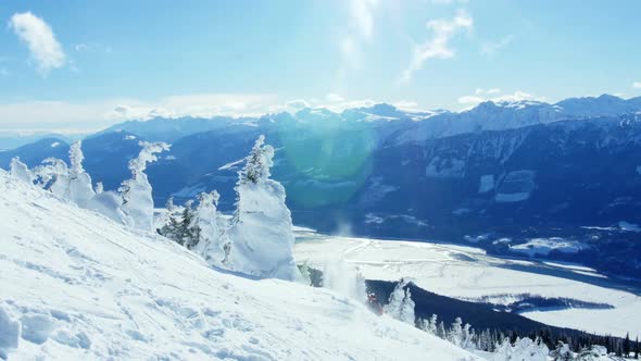 Person snowboarding on snowy mountain