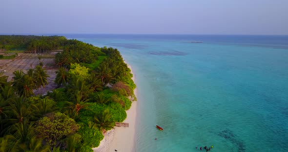 Tropical above abstract shot of a sunshine white sandy paradise beach and aqua turquoise water backg