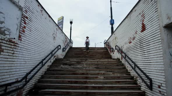 Romanian girl descends into a old pedestrian passage 1