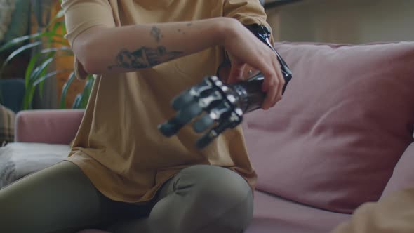 Girl Putting on Prosthetic Arm