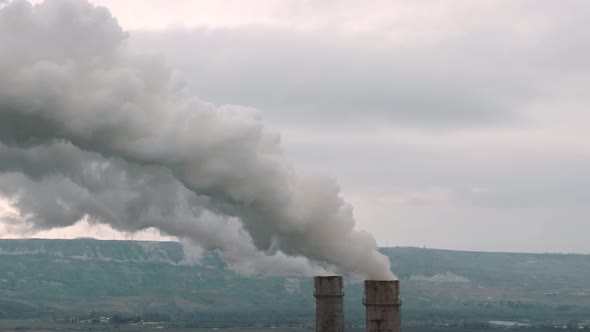 Air Pollution From Smoke Coming Out of Two Factory Chimneys