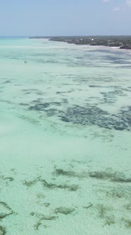 Vertical Video of Low Tide in the Ocean Near the Coast of Zanzibar Tanzania