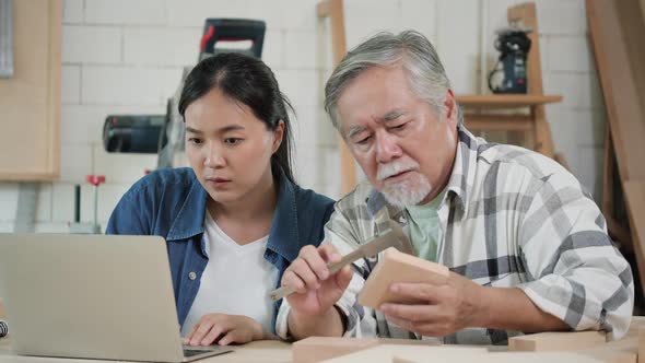 Senior man and woman working with wood