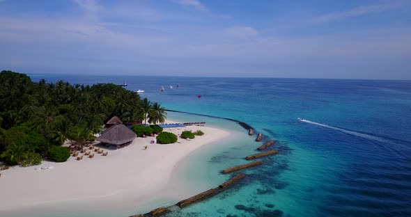 Wide angle drone abstract view of a sandy white paradise beach and blue sea background in best quali