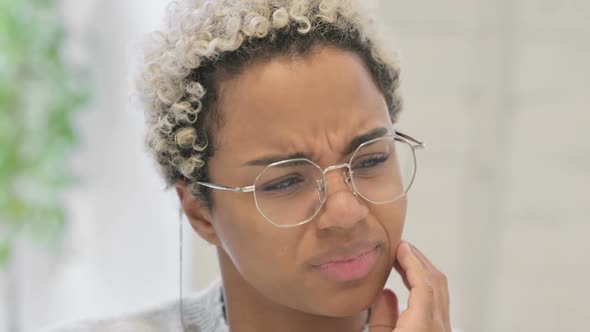 Close Up of African Woman Having Cavity Toothache
