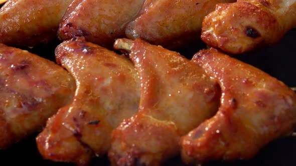 Closeup Panorama of the Delicous Chicken Wings Preparing Above the Open Fire