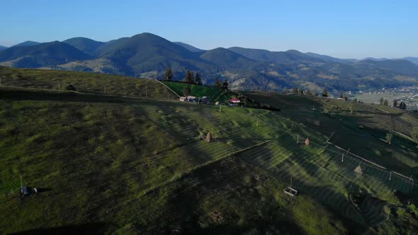 Aerial View of Green Meadow Landscape in Mountains