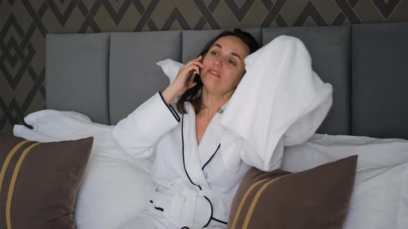 Woman in Bathrobe Drying Hair After Shower in Bed