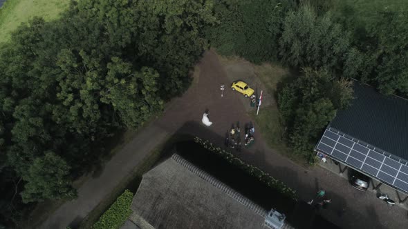 Aerial of an Wedding where the Bridesmaids and Bride are Visible during Sunset