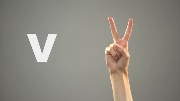 Letter v in Sign Language, Hand on Background, Communication for Deaf, Lesson