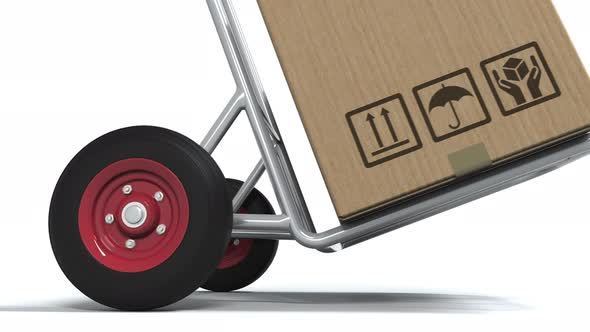 DELIVERY Text on Carton on an Isolated Delivery Cart alt