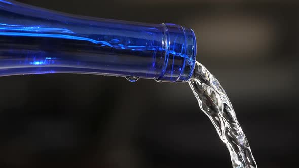 Water Pouring From a glass Bottle