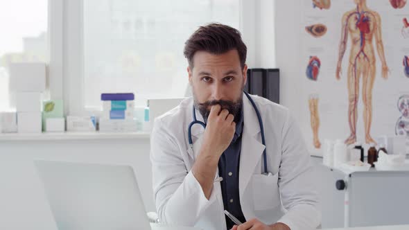 Handheld video shows of male doctor ready for work. Shot with RED helium camera 