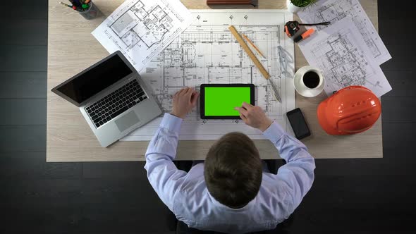 Engineer Viewing Online Layout of Building Project, Using Green Screen Tablet