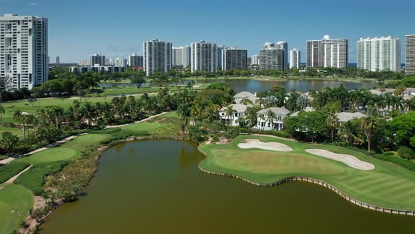 Miami Skyline, Florida, USA.  Cinematic Aerial View of Green Golf Course