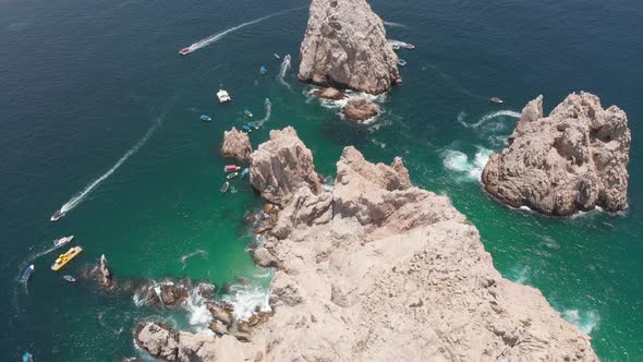 Aerial View of Rock Formations in Ocean with Boats