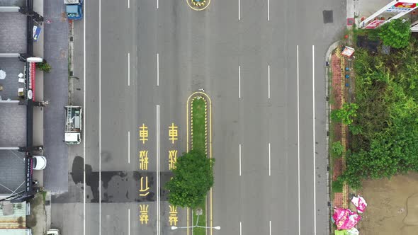 Bird Eye View Aerial Drone Footage of Asphalt Road in Taiwan, drone flying along the straight road.