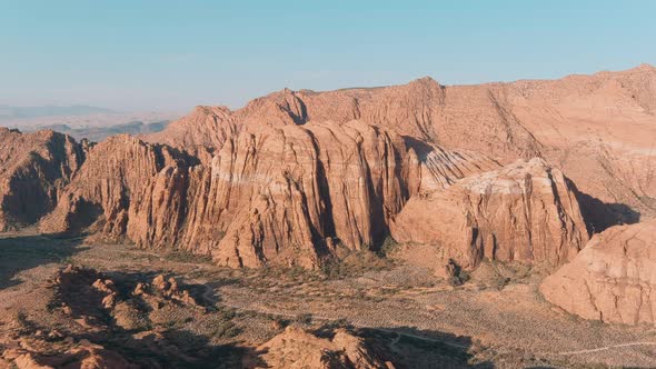 Wide establishing aerial of the epic lava flows at Snow Canyon State Park.