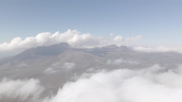 Scenic aerial view of moving white clouds at Abuli Mountain. Georgia