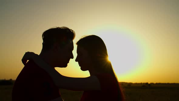 Passionate Couple Bonding in Nature at Sundown