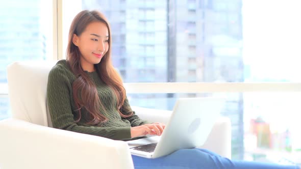 Young asian woman use laptop