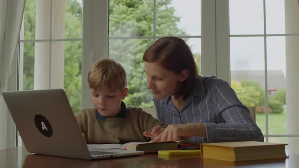 Mother Helping Her Son with Homework