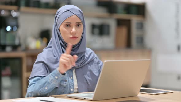 Arab Woman with Laptop Showing No Gesture, Disapprove 