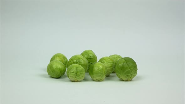 A Few Brussels Sprouts Appear in the Frame  Rotating  and Running Away
