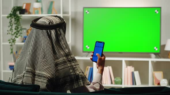 Middle Eastern Man Using Phone with Chroma Key Closeup