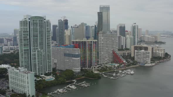 Wider aerial view of multiple buildings in downtown Miamiing from right to left