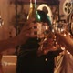 Young man pouring wine to his friends they cheer together with vintage projector in the back - VideoHive Item for Sale
