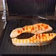 Two Pieces Salmon Fish Are Cooking On The Electric Grill - VideoHive Item for Sale
