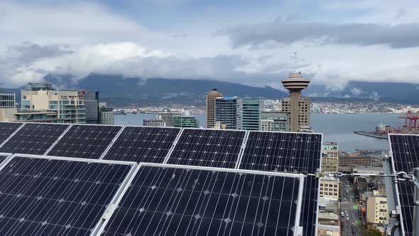 Rooftop solar power photovoltaic system skyline Vancouver cityscape downtown Canada. green sustainab
