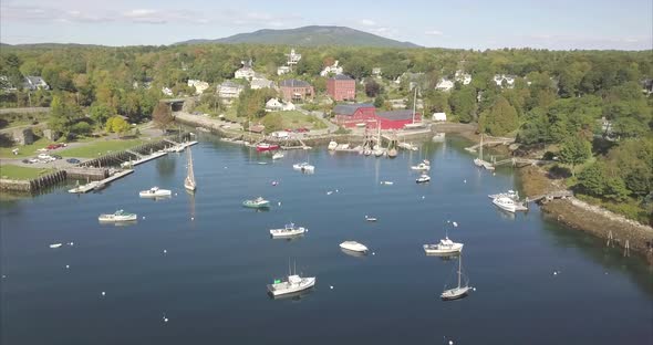 Rockport Harbor, Maine on a beautiful sunny day with ships heading out to sea.