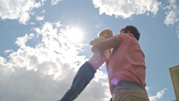 Dad Playing with Happy Child