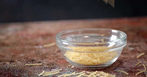 In a Glass Bowl Falls Dry Pasta of Vermicelli