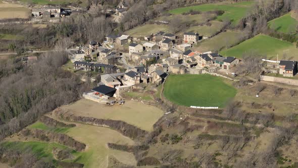 Traditional Houses and Green Agricultural Fields of Serrat Village in Girona Catalonia Spain