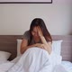 Lonely young woman feeling depressed and stressed sitting in the bedroom - VideoHive Item for Sale