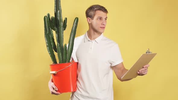 Portrait of Pleasant Young Caucasian Delivery Man, Courier