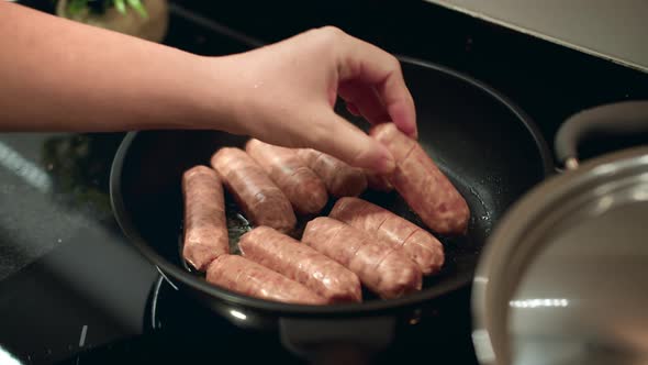 Cooking Meat Sausages in a Pan