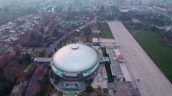 Aerial orbit of O'Higgins Park, music venue dome building and amusement park in Santiago Centro dist