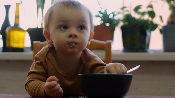 Toddler Boy Eats Buckwheat Porridge